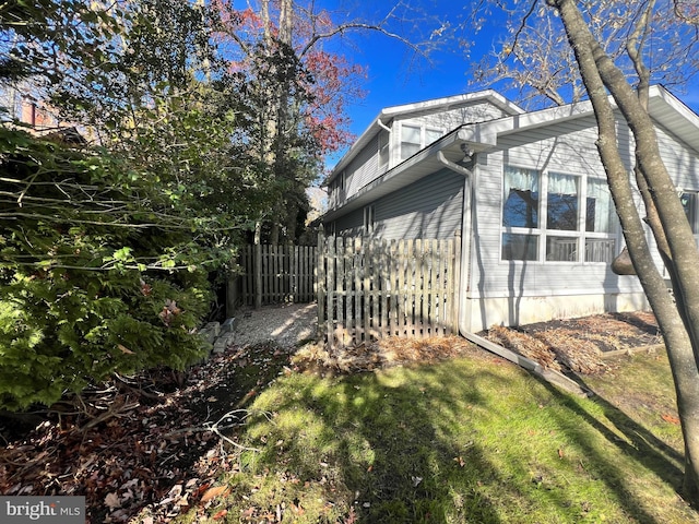 view of home's exterior with a yard