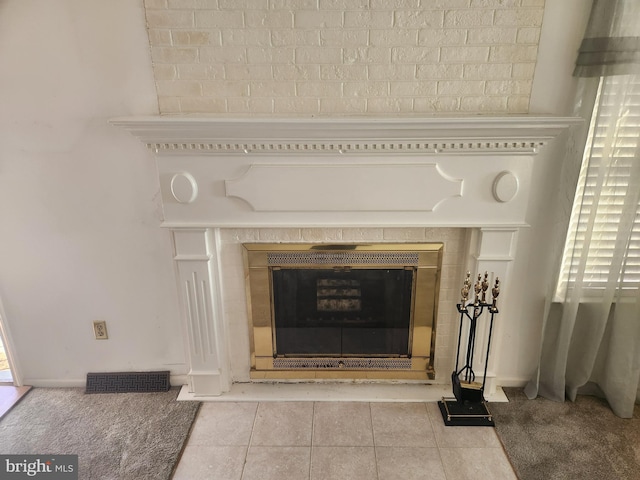 details featuring carpet flooring and a tiled fireplace