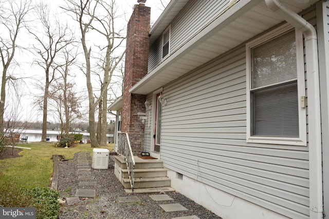 view of side of home featuring a yard