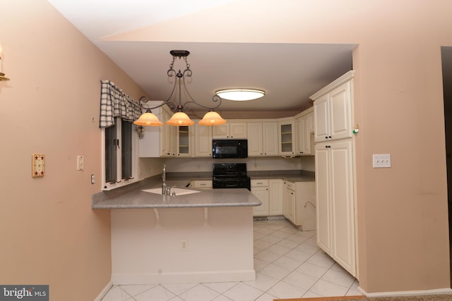 kitchen with black appliances, sink, decorative light fixtures, a kitchen bar, and kitchen peninsula