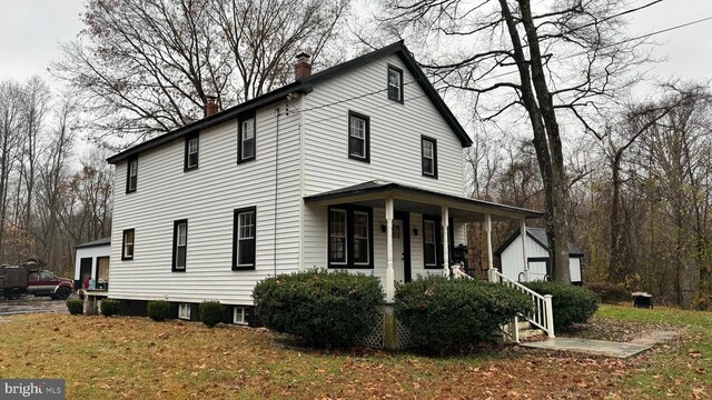 8067 Croom Rd, Upper Marlboro, MD 20772 - view of front of property with covered porch and a chimney