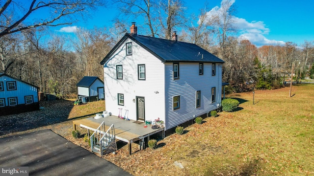 8067 Croom Rd, Upper Marlboro, MD 20772 - view of front of property with a chimney, a front lawn, and metal roof