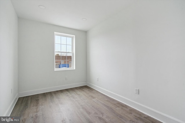 unfurnished room with light hardwood / wood-style floors