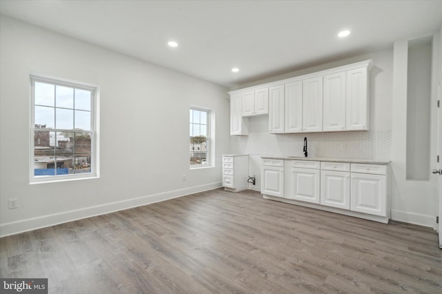 interior space with sink and light hardwood / wood-style floors