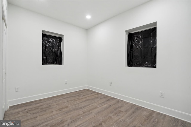 unfurnished room featuring light hardwood / wood-style flooring