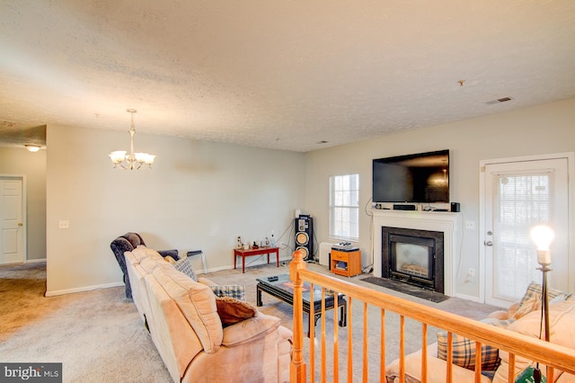 carpeted living room featuring a textured ceiling and an inviting chandelier