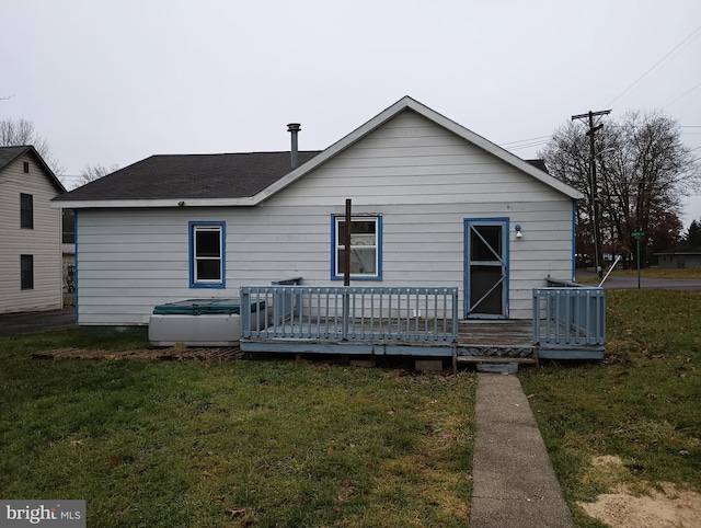 exterior space featuring a deck, a yard, and central air condition unit