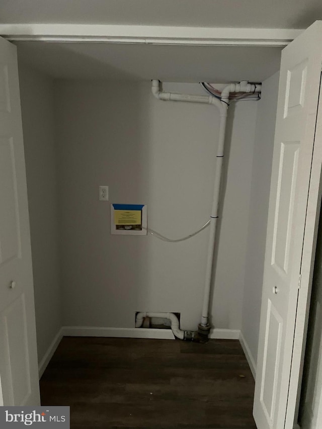 laundry area featuring dark wood-type flooring