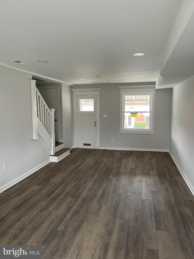 foyer entrance with dark hardwood / wood-style flooring