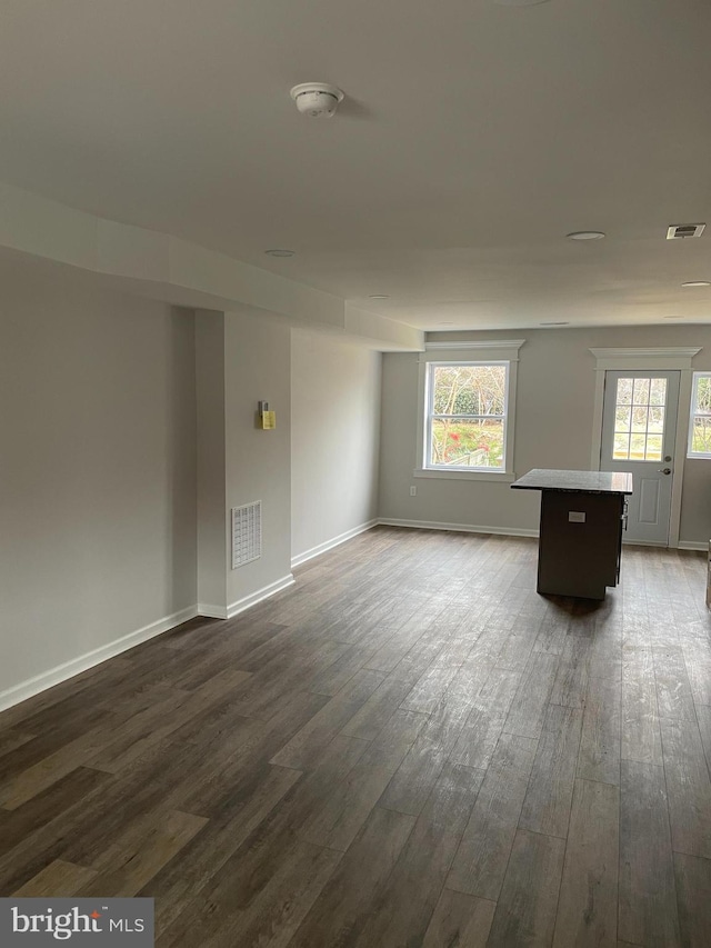 empty room featuring dark hardwood / wood-style flooring