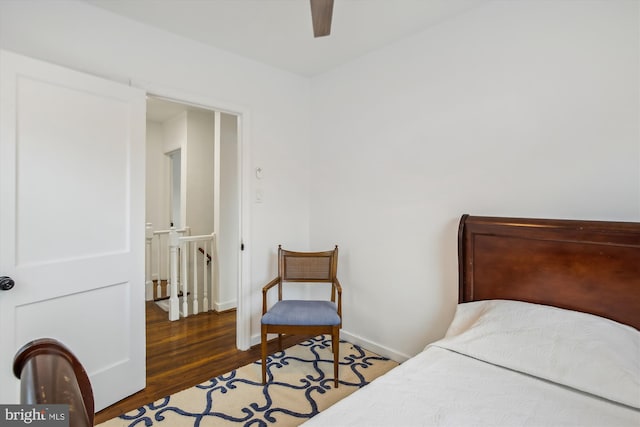 bedroom featuring ceiling fan and dark hardwood / wood-style floors