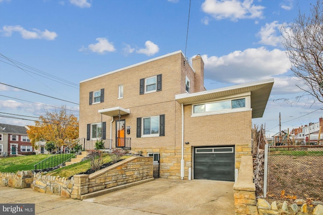 view of front of property with a garage