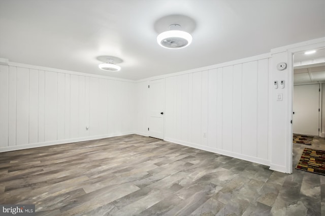 spare room featuring wood-type flooring