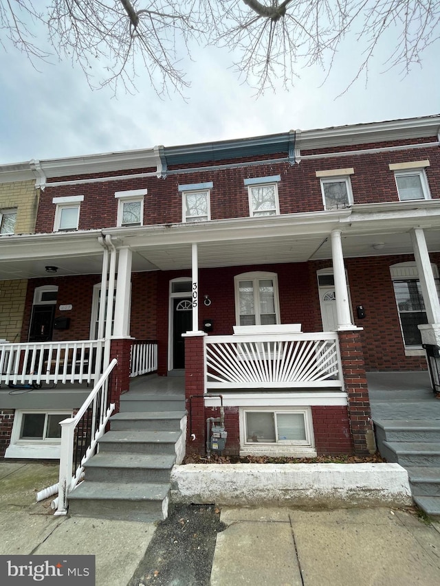 view of property with covered porch