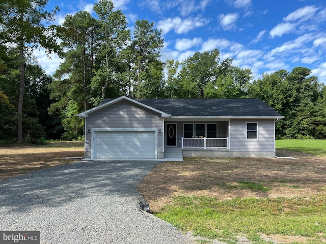 view of front of home with a porch and a garage