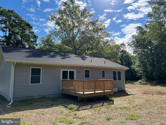 rear view of property with a deck