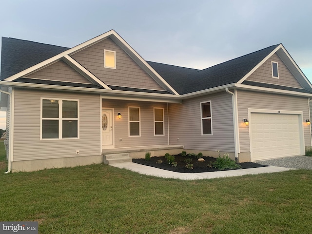 view of front of property with a front lawn and a garage