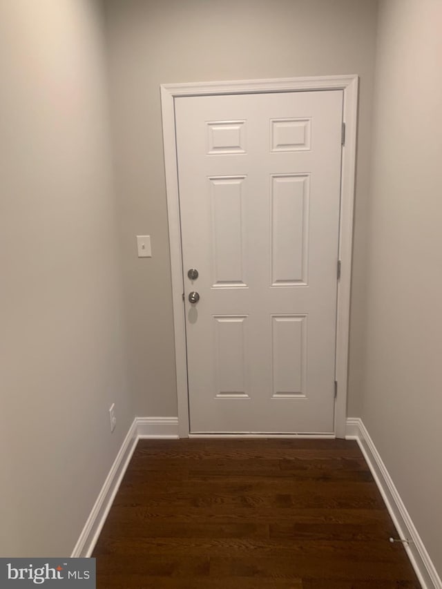 doorway to outside with dark wood-type flooring