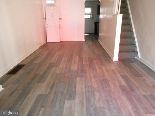 interior space with dark wood-type flooring