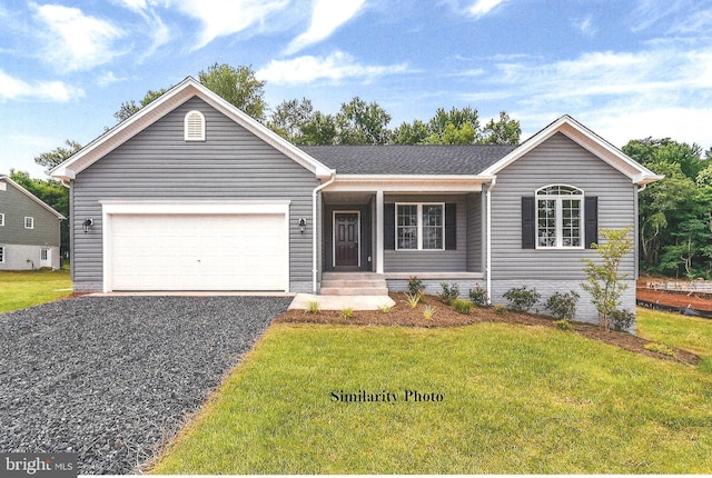 single story home with a garage, a front yard, and driveway