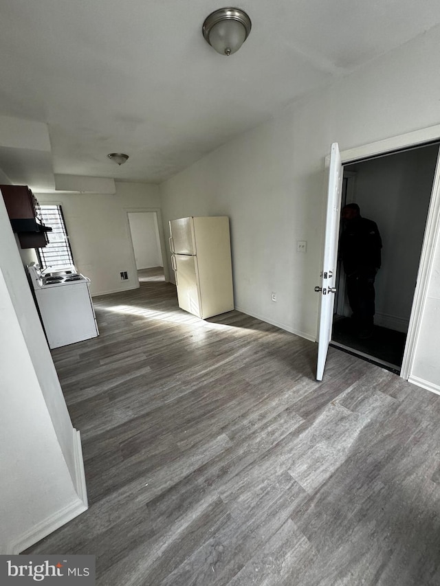 unfurnished living room featuring dark wood-type flooring