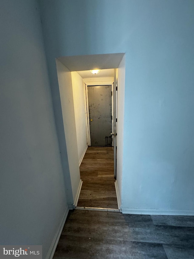 stairway with hardwood / wood-style flooring