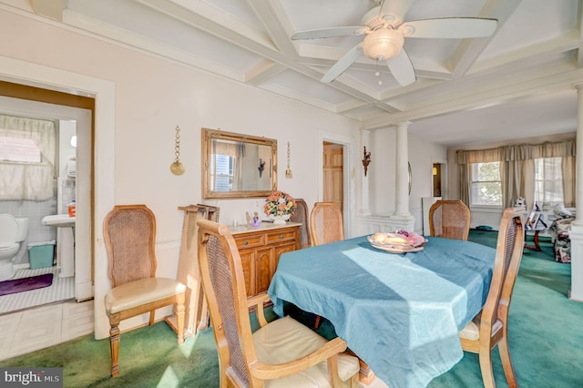 carpeted dining area featuring coffered ceiling, decorative columns, ceiling fan, and beam ceiling