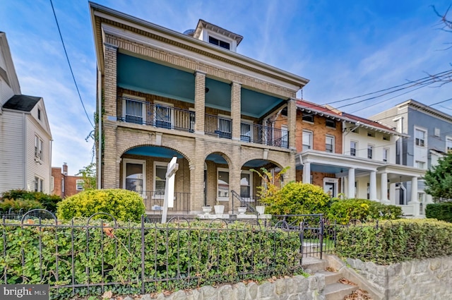 view of front of house featuring a balcony