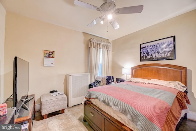 bedroom with ceiling fan and light tile floors