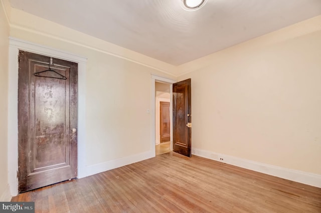 spare room with light wood-type flooring