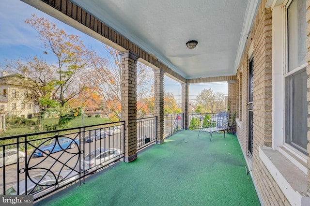 view of patio featuring a balcony