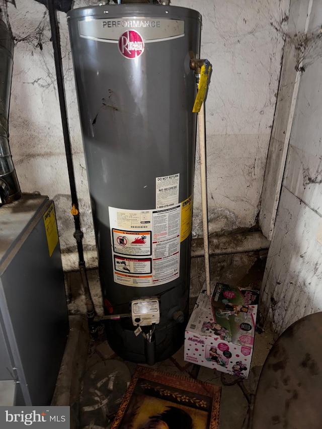 utility room featuring gas water heater