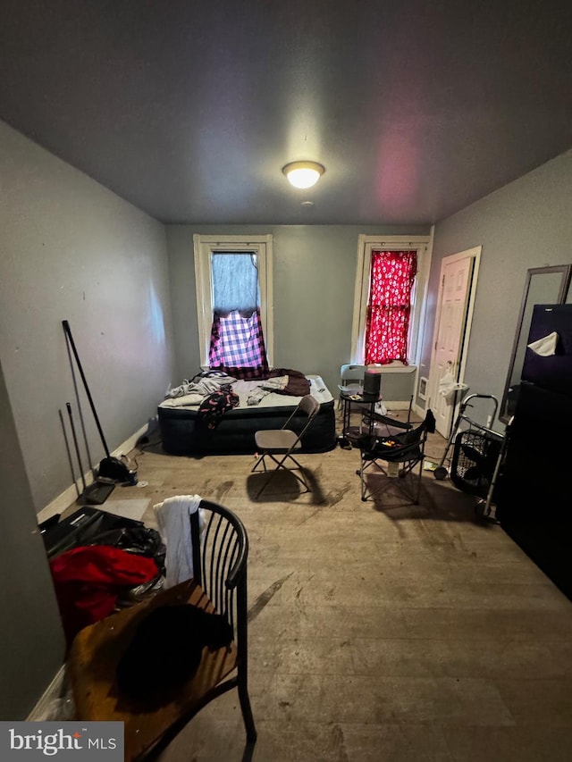 bedroom with black refrigerator