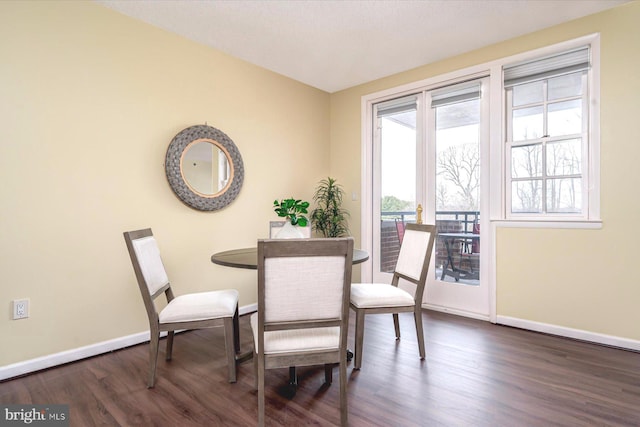 dining area featuring dark hardwood / wood-style flooring