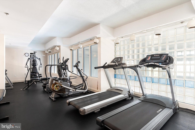 workout area with a textured ceiling