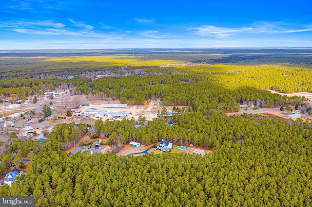 drone / aerial view with a view of trees