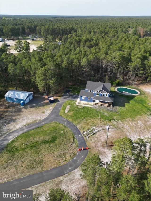 aerial view featuring a view of trees