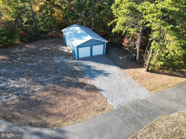 view of outbuilding with a garage and an outdoor structure