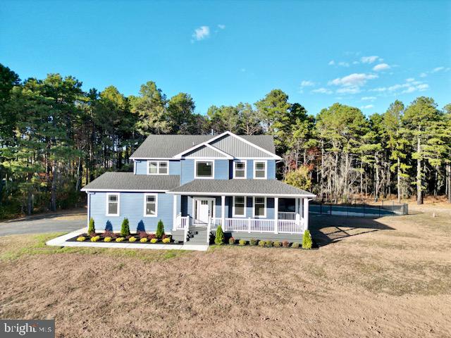 view of front of home featuring a front lawn and a porch