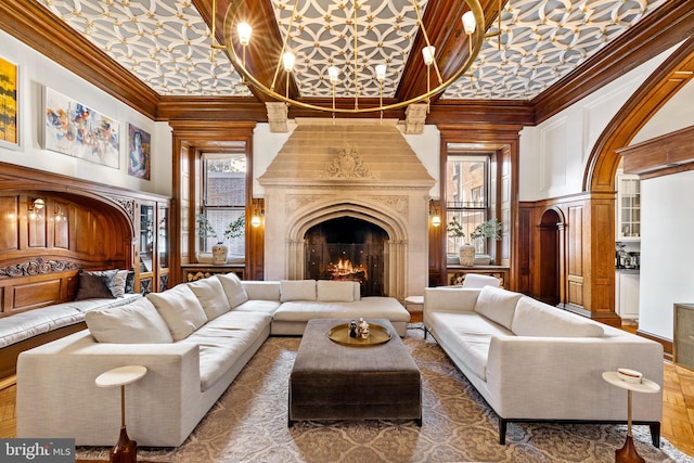 interior space with ornamental molding, a high ceiling, and a premium fireplace