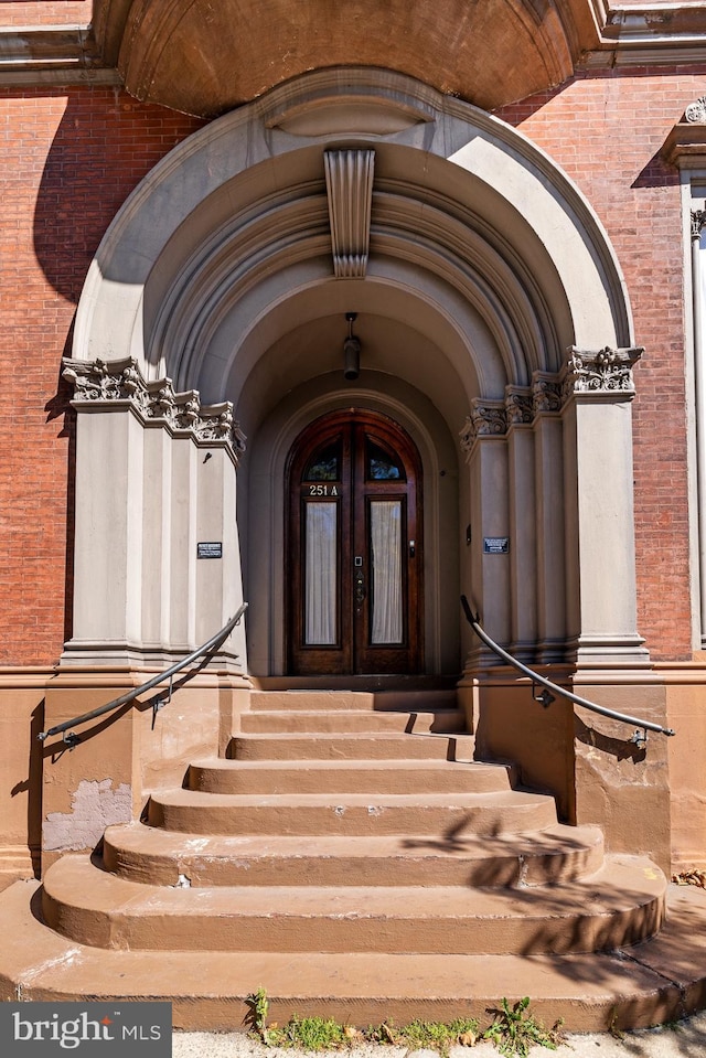 entrance to property featuring french doors