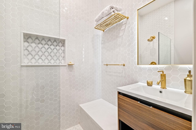 bathroom with vanity and tasteful backsplash