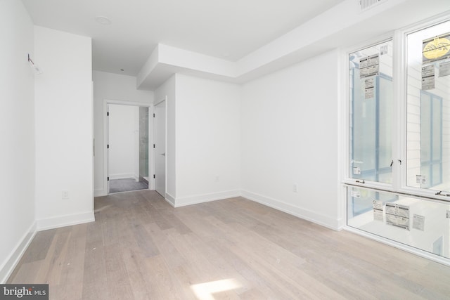 unfurnished room featuring light hardwood / wood-style flooring