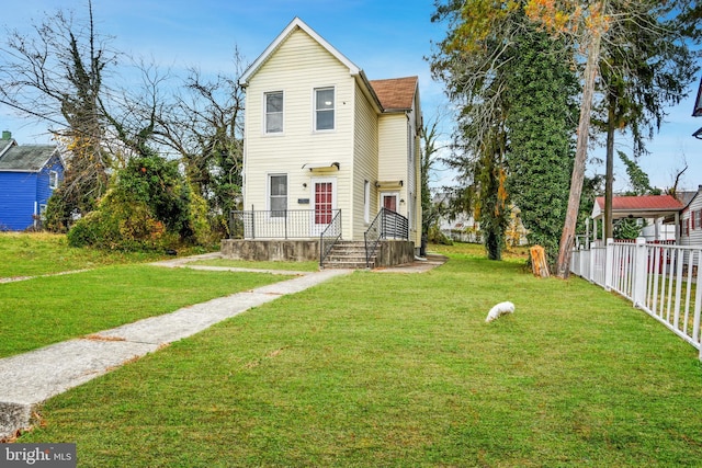 view of property featuring a front yard