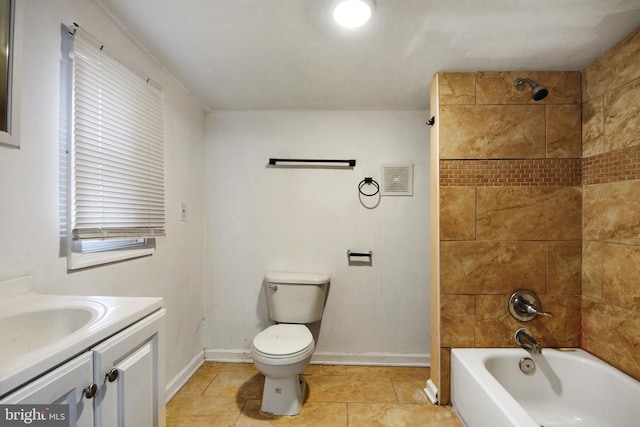 full bathroom with tile patterned floors, vanity, toilet, and tiled shower / bath