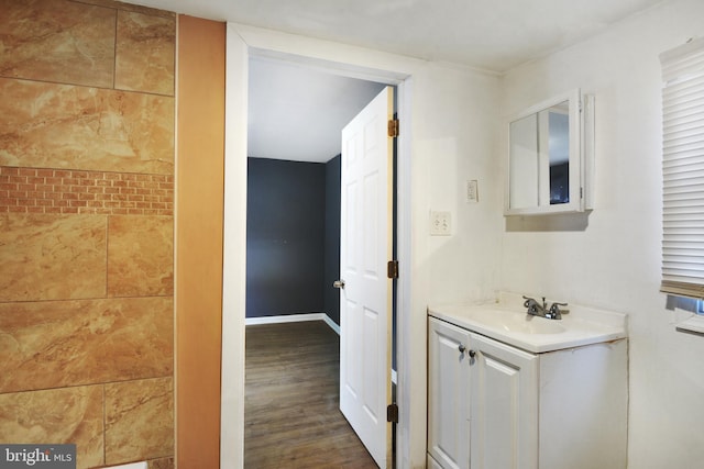 bathroom featuring hardwood / wood-style flooring and vanity