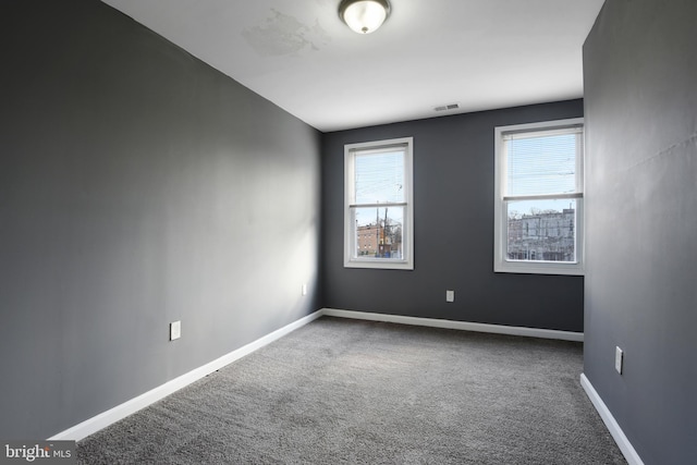 spare room featuring carpet floors