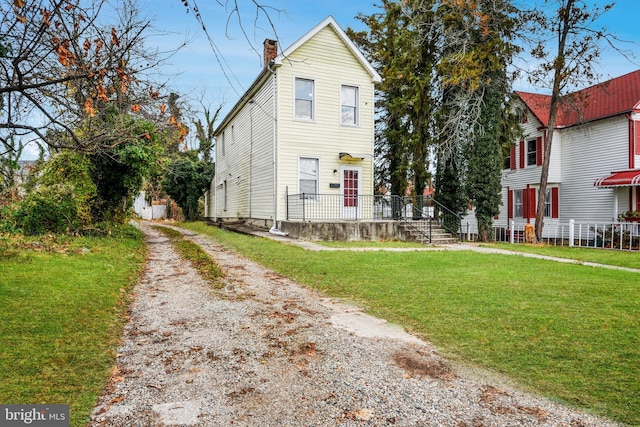 view of property with a front lawn