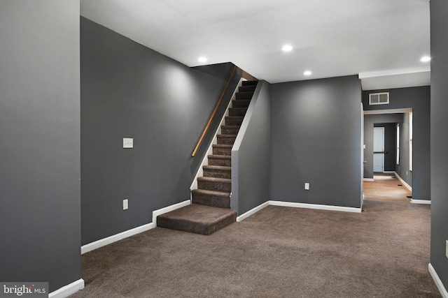 basement with carpet flooring