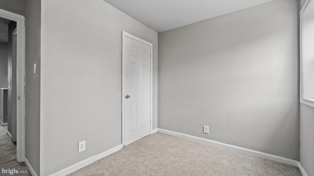 unfurnished bedroom featuring light colored carpet